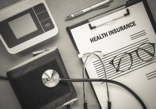 imageye___-_imgi_56_top-view-health-insurance-form-eyeglasses-pulse-gauge-with-stethoscope-wooden-background_1921-30